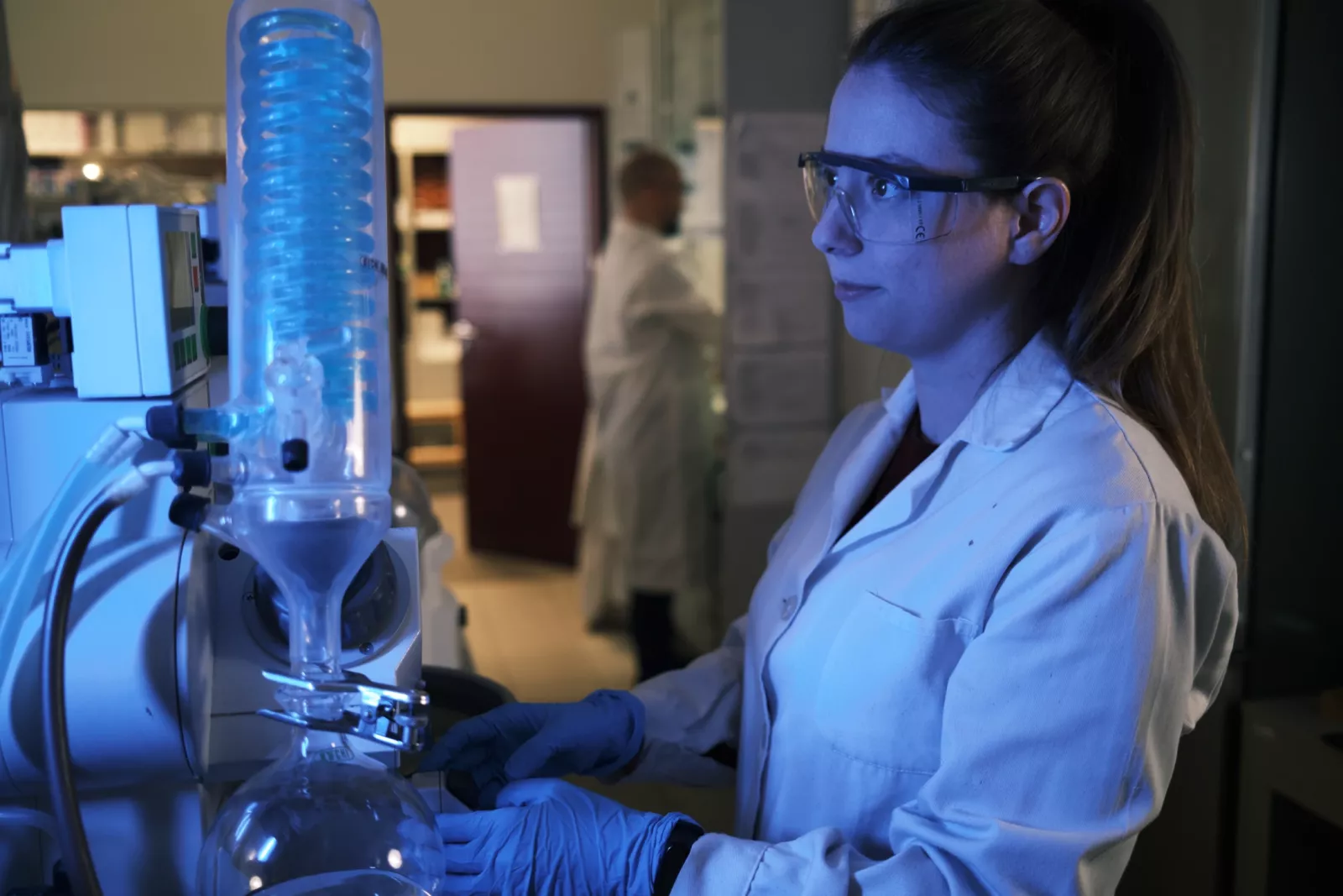 Researcher working with laboratory equipment